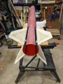 White fiberglass fins attached to a red fiberglass body tube, with black (ProLine) fillets.